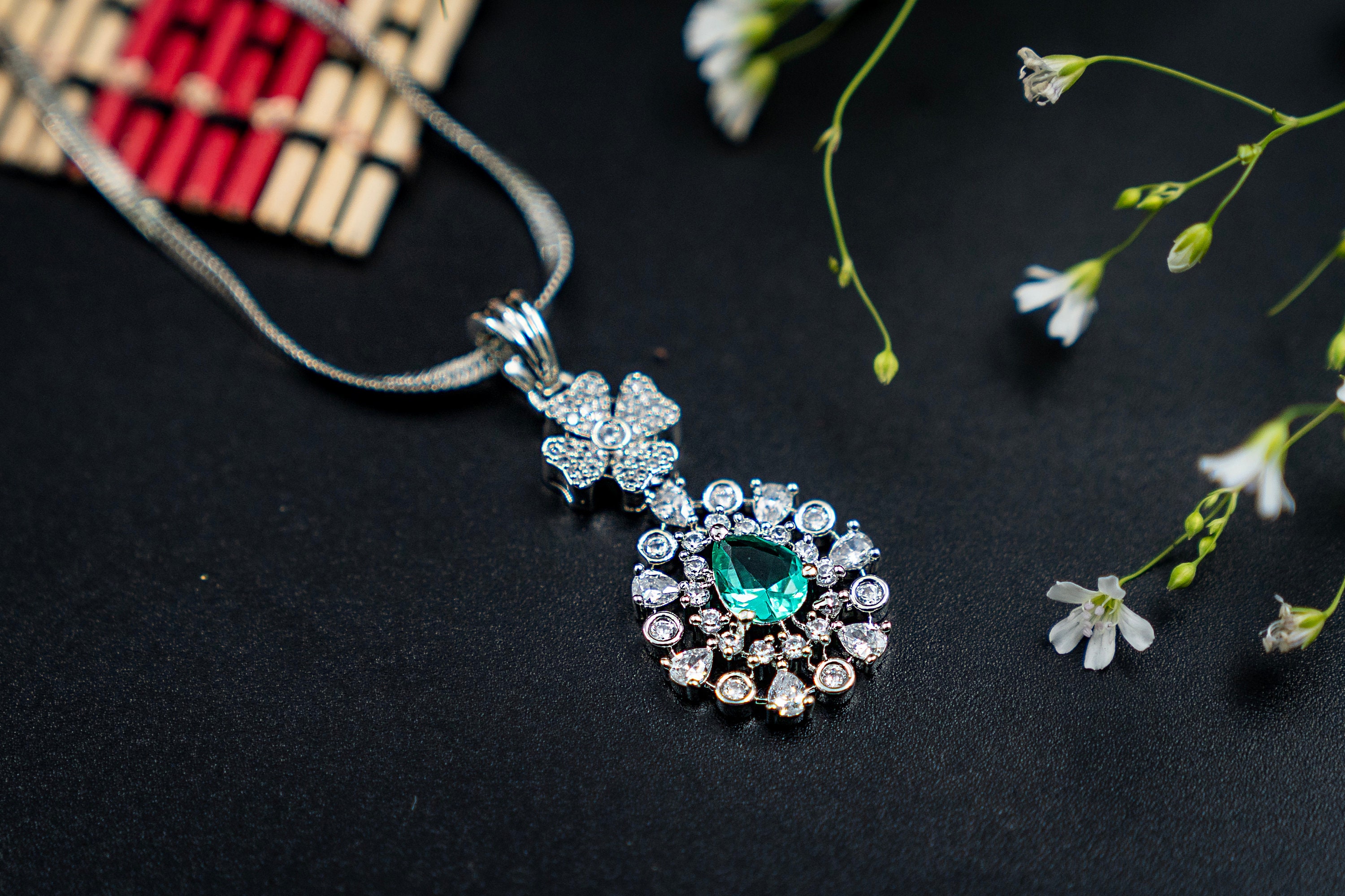 Diamond pendant set with colour stone best sale