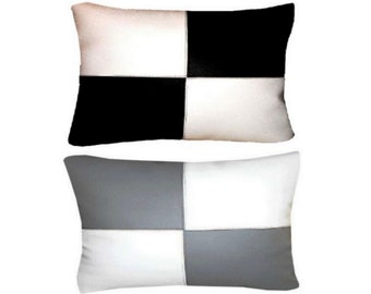 Coussin simili cuir 50x30cm 2 coloris au choix: blanc/noir ou blanc/gris