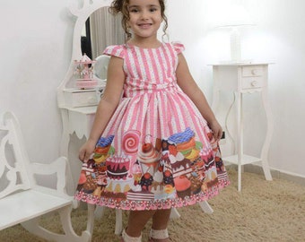 Girl&#39;s confectionery dress with cupcake, cakes and candy, birthday party