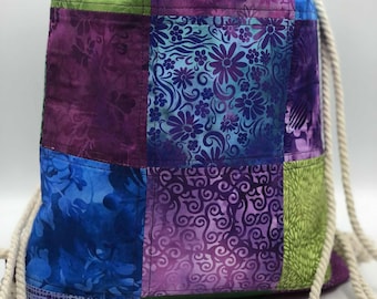 Patchwork Drawstring Backpack: Multi-Patterned Cotton Cinch Bag with Pocket