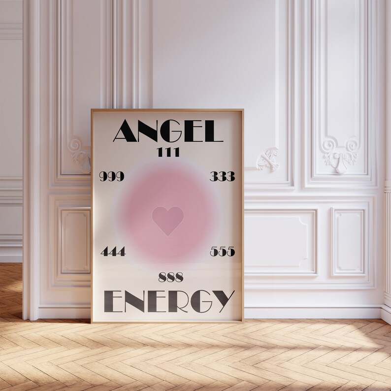 May include: A poster with a pink heart in the center and the words "ANGEL ENERGY" in black text. The numbers 111, 333, 444, 555, 888, and 999 are also printed on the poster.