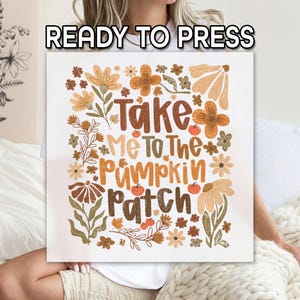 May include: A square, off-white sign with the text "Take Me To The Pumpkin Patch" in brown and orange lettering, surrounded by floral illustrations in similar colors. The words "READY TO PRESS" are at the top.
