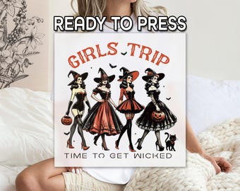 May include: A square canvas print with the text "READY TO PRESS" at the top. The image features four women dressed as witches, holding pumpkins, with the words "GIRLS TRIP" and "TIME TO GET WICKED". The witches are in black and orange dresses.