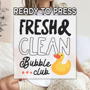 May include: A white square sign with the words "FRESH & CLEAN" in black, and "Bubble Club" in a script font. A yellow rubber duck with an orange beak is on the right. The words "READY TO PRESS" are at the top.