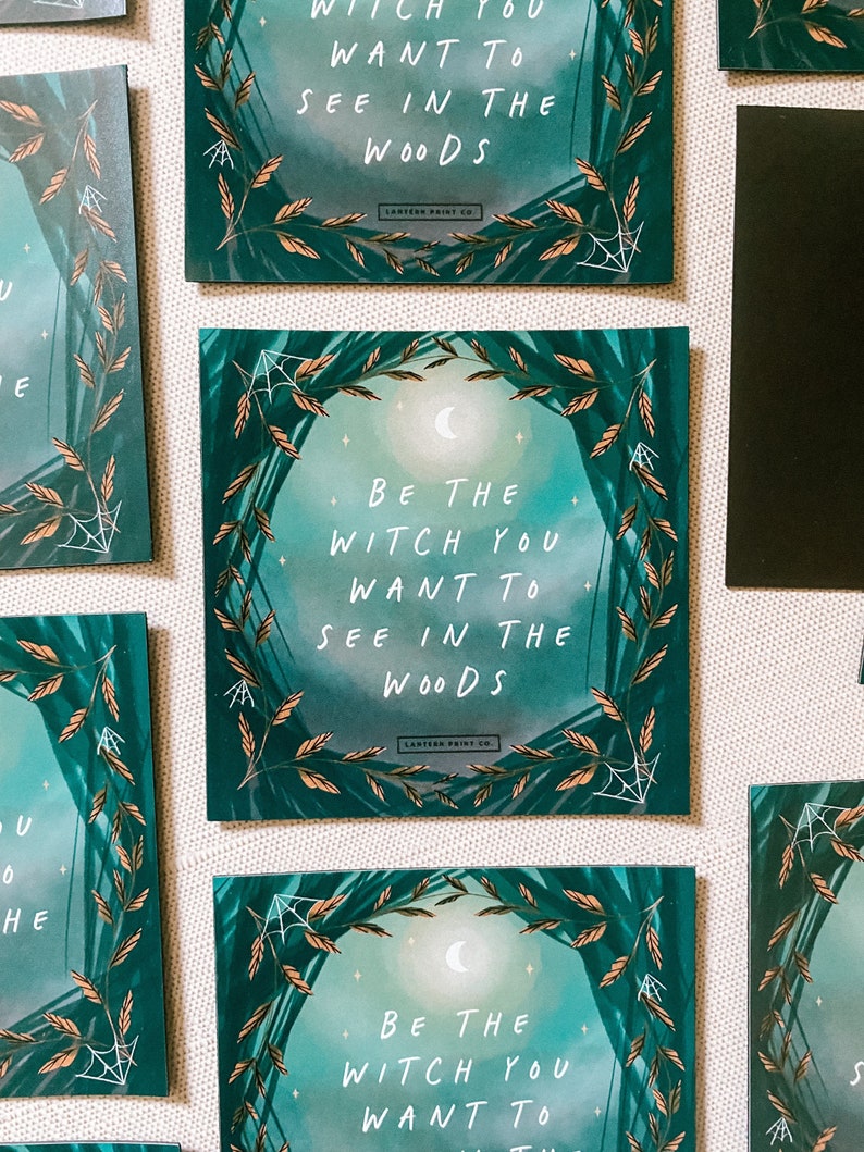 May include: A set of three square teal green and gold framed prints with the text "Be the witch you want to see in the woods" on each print. The prints have a moon and stars in the background.