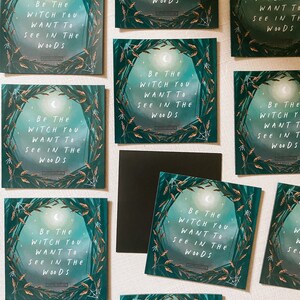 May include: A set of nine square cards with a green, black, and white design. Each card features a crescent moon and the text "Be the witch you want to see in the woods".