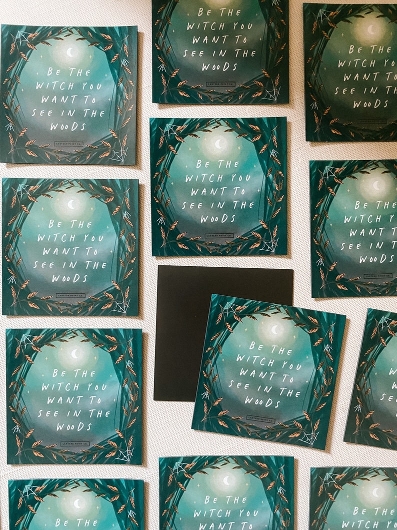 May include: A set of nine square cards with a green, black, and white design. Each card features a crescent moon and the text "Be the witch you want to see in the woods".