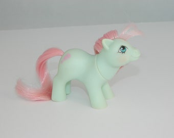 baby cuddles my little pony