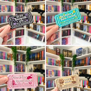 May include: A collection of four rectangular ticket-shaped bookmarks featuring book club themes. The black ticket reads In my bookish era, the teal ticket reads brother's best friend, the pink ticket reads cowboy romance, and the tan ticket reads cozy vibes.