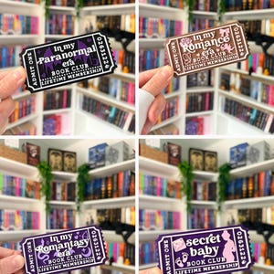 May include: Four rectangular ticket-shaped bookmarks featuring book club themes. The designs include text reading In my Paranormal era, In my Romance era, In my Romantasy era, and secret baby, each with unique icons and the text Lifetime Membership.