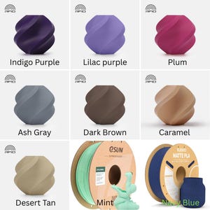 May include: A collection of 3D printed vases in various colors including indigo purple, lilac purple, plum, ash gray, dark brown, caramel, desert tan, mint, and navy blue. Each vase features a spiraling, twisted geometric design.