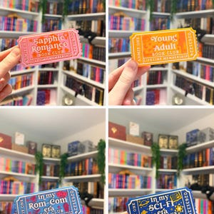 May include: Four rectangular admission ticket-style bookmarks in pink, yellow, light blue, and dark blue. Each features the text "ADMIT ONE," a serial number, and "LIFETIME MEMBERSHIP" with specific genre titles: "Sapphic Romance," "Young Adult," "In my Rom-Com era," and "In my SCI-FI era."