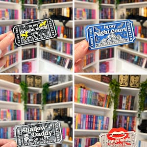 May include: A collection of four rectangular ticket-shaped bookmarks featuring various book club themes. Each ticket displays the text 'ADMIT ONE', a unique club name, 'BOOK CLUB', and 'LIFETIME MEMBERSHIP' with a serial number 02631224 on the right side.