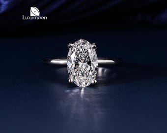 Anillo de compromiso de oro macizo con diamantes cultivados en laboratorio, halo oculto y forma ovalada.