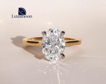 Anillo de compromiso ovalado con diamante cultivado en laboratorio y halo oculto, oro macizo.