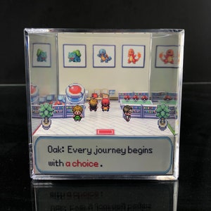 May include: A 3D diorama of a scene from the Pokemon video game series. The diorama features a pixelated image of Professor Oak, the player character, and three Pokemon: Bulbasaur, Charmander, and Squirtle. The text "Oak: Every journey begins with a choice." is displayed in a speech bubble.