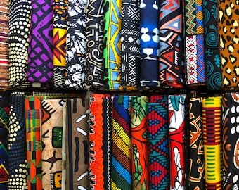 May include: A collection of colorful fabric scraps with various patterns, including geometric, floral, and abstract designs. The fabrics are arranged in rows and are all different sizes and shapes.