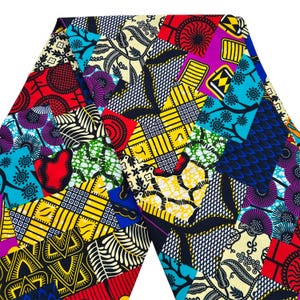 May include: A vibrant patchwork fabric featuring a variety of geometric and floral patterns in a kaleidoscope of colors. The design includes red, yellow, blue, purple, and green, creating a bold and eye-catching textile.
