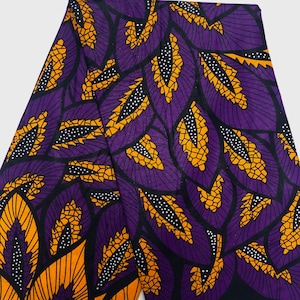 May include: Purple and gold fabric with a repeating pattern of stylized leaves. The leaves are outlined in black and have a textured, geometric design.