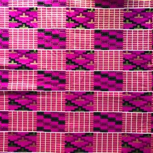 May include: Pink and black fabric with a geometric pattern. The pattern features gold accents and a repeating design of squares and rectangles.