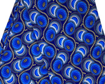 May include: Blue and gold fabric with a repeating pattern of stylized flowers and circles. The fabric has a white background.