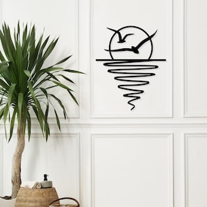 Arte de pared de metal con sol y gaviotas, decoración del amanecer