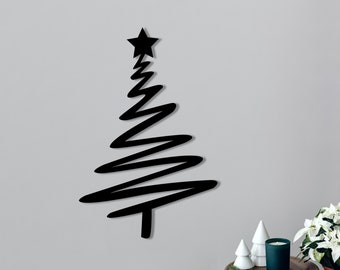 May include: Black metal Christmas tree wall decor with a star on top. The tree is made of a series of wavy lines.