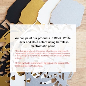 May include: Close-up of color samples for a product. The samples are in black, white, silver, and gold. The text reads: "We can paint our products in Black, White, Silver and Gold colors using harmless electrostatic paint."  The close-up products in the picture reflect the real colors exactly. During shooting in a decorated location, color differences may occur in other images of our products due to factors such as light, distance and pain. Please evaluate our products by taking into account the color samples in this picture.
