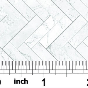 May include: White marble tile with a herringbone pattern. The tile is 1 inch wide and has a smooth, polished finish.