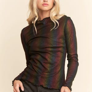 May include: A set of three ceramic mugs with a speckled, matte finish. The mugs are in shades of cream, light gray, and dark gray. Each mug has a simple, minimalist design, perfect for coffee or tea.