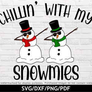 Two cool snowmen, wearing sunglasses and a green and red scarf with top hats, are dabbing. The text "Chillin with my snowmies" surrounds the snowmen.