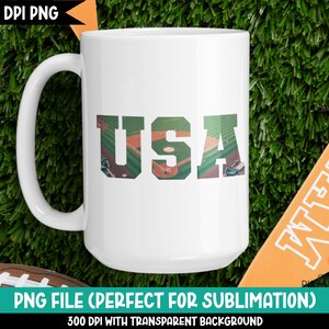 May include: White ceramic mug with a graphic of a baseball field in the shape of the letters "USA".