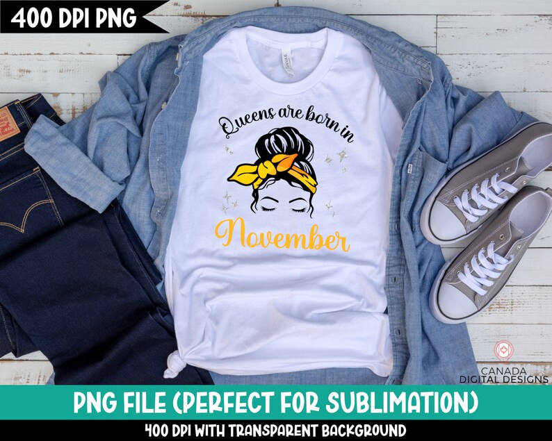 May include: White t-shirt with a graphic design of a woman with a yellow headband and the text "Queens are born in November".