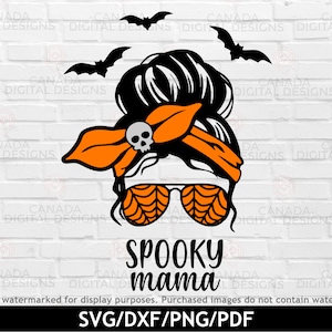 May include: A black and orange Halloween-themed design featuring a woman with a messy bun, a skull bandana, and spiderweb sunglasses. The text "Spooky mama" is below the image.