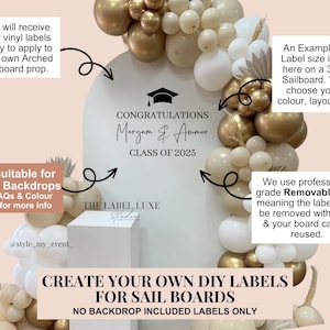 May include: A white arched sailboard backdrop decorated with gold and white balloons, featuring black vinyl text that reads CONGRATULATIONS Maryam & Ammar CLASS OF 2025 with a graduation cap icon. The display includes informational text boxes.