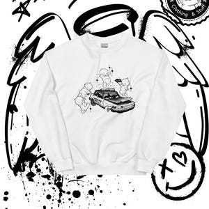 May include: White sweatshirt with a black and white graphic print of a car with cherubs around it. The text "The Kewpie Squad Clothing & Stuff" is in a circle at the top right of the image. The text "@thekewpiesquad" is at the bottom of the image.