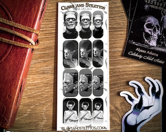 May include: A set of 12 black and white nail decals featuring images of Frankenstein's monster. The decals are arranged in a grid of four rows and three columns. The text "CLAWS AND STILETTOS NAIL DECALS" is at the top of the image. The text "CLASSIC FRANKENSTEIN" is at the bottom of the image.