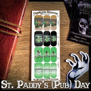 May include: A sheet of nail decals featuring a St. Patrick's Day theme. The decals feature a green, black, and white color scheme with images of leprechauns, shamrocks, and the text "Paddy's Irish Pub".