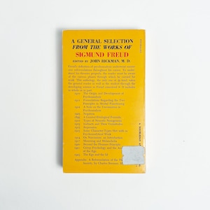 May include: A yellow paperback book titled "A General Selection From The Works of Sigmund Freud." Edited by John Rickman, M.D. The book's cover features a list of contents and the publisher's name.