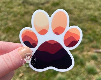 Pegatina con huella de pata y puesta de sol en las montañas, regalo para amantes de los perros.