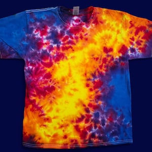 May include: A tie-dye t-shirt with a blue, red, yellow, and orange swirl pattern.