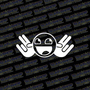 May include: White sticker featuring a stylized smiley face with hands making a 'shaka' gesture. The background is a repeating pattern of the text 'SLAP SHOP' in white on a black background.