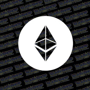 May include: A white circle with a black Ethereum cryptocurrency logo in the center. The logo is a geometric shape that resembles a diamond.