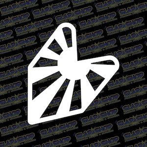 May include: White vinyl sticker with a stylized sunburst design. The sunburst is a geometric shape with rays emanating from a central circle.