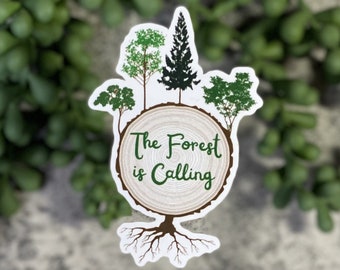 May include: A white sticker with a brown tree stump design and the text "The Forest is Calling".  The sticker features four green trees, including a pine tree, and white roots.