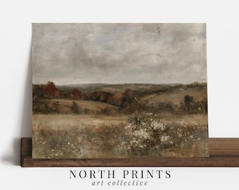 May include: A rectangular landscape print featuring a muted, earthy palette of beige, brown, and muted green tones. The scene depicts a rolling field with a cluster of white wildflowers in the foreground, distant trees, and a cloudy, overcast sky.