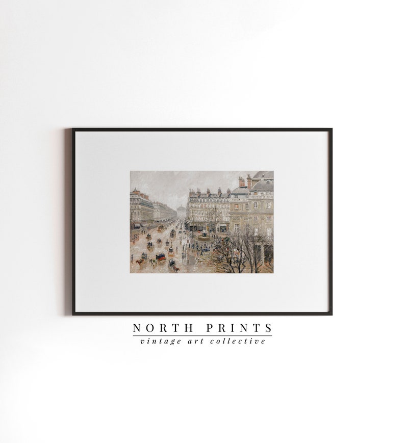 May include: A framed print showcasing a vintage street scene in muted tones. The artwork depicts a busy city street with horse-drawn carriages, buildings, and people. The print is framed in a black border and features the text "NORTH PRINTS vintage art collective".