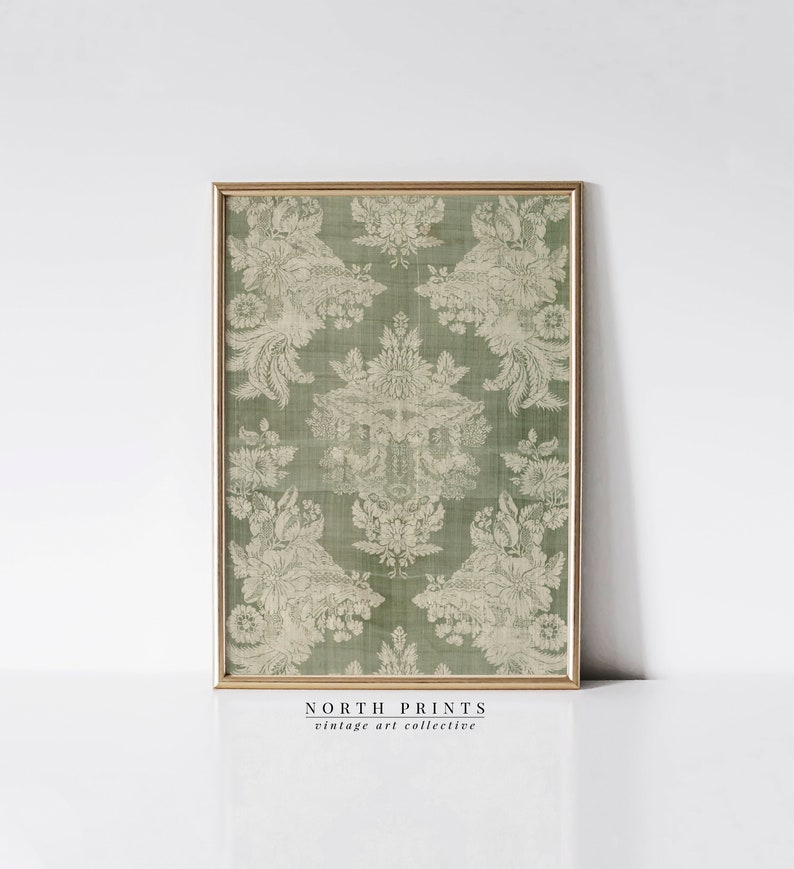 May include: A framed print of a vintage green and white damask pattern. The print is titled "NORTH PRINTS vintage art collective".