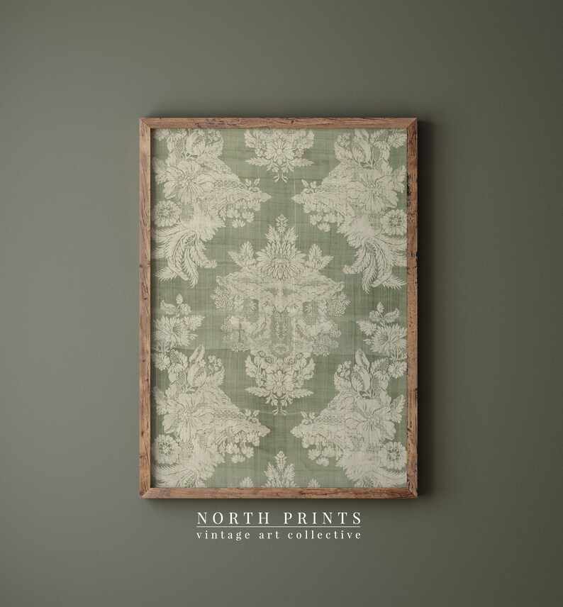 May include: A framed print of a vintage green and white damask pattern. The print is in a wooden frame and has a distressed look. The text "NORTH PRINTS vintage art collective" is at the bottom of the image.