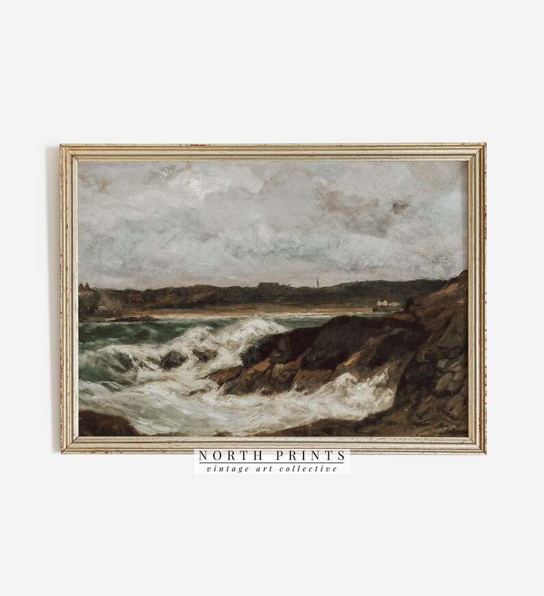 May include: A vintage painting of a stormy seascape with crashing waves and a rocky coastline. The painting is framed in a gold-colored frame and has a muted color palette of blues, grays, and browns.
